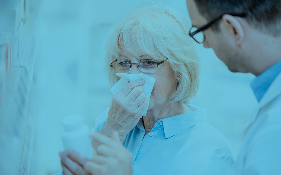 Pharmacist talking to customer