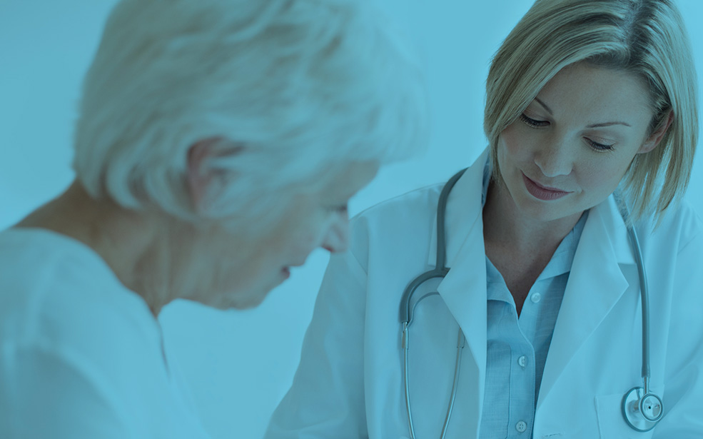 Female doctor examining senior patient